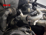 Audi A/C line quick disconnect couplers installed beside the high and low pressure service ports